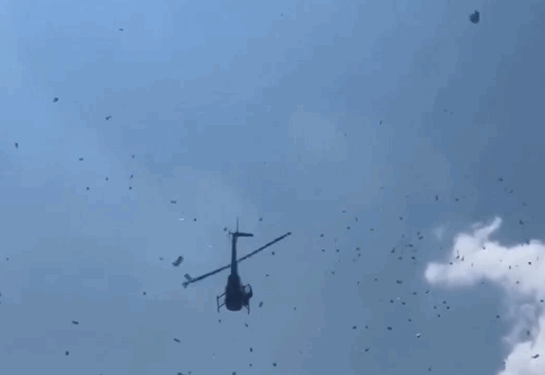 LLUVIA DE DÓLARES; HELICÓPTERO ESPARCE MILES DE BILLETES EN DETROIT 1 LLUVIA DE DÓLARES; HELICÓPTERO ESPARCE MILES DE BILLETES EN DETROIT